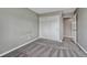 Simple gray bedroom with sliding closet door and soft gray carpet at 7114 Mountain Brush Cir, Highlands Ranch, CO 80130