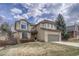 Charming two-story home with a well-maintained lawn and attached two-car garage at 7114 Mountain Brush Cir, Highlands Ranch, CO 80130