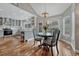 Open kitchen and dining area features hardwood floors and access to a patio at 7114 Mountain Brush Cir, Highlands Ranch, CO 80130
