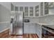 Spacious kitchen showcases a stainless steel refrigerator, gray cabinets, and tiled backsplash at 7114 Mountain Brush Cir, Highlands Ranch, CO 80130