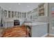 Well-lit kitchen with stainless steel appliances, custom cabinets, and tiled backsplash at 7114 Mountain Brush Cir, Highlands Ranch, CO 80130