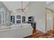 Spacious living room with a brick fireplace, built-in shelves, and vaulted ceiling at 7114 Mountain Brush Cir, Highlands Ranch, CO 80130