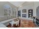 Comfortable living room boasts a brick fireplace with arched shelving at 7114 Mountain Brush Cir, Highlands Ranch, CO 80130