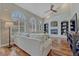 Inviting living room has vaulted ceilings, arched windows and a brick fireplace at 7114 Mountain Brush Cir, Highlands Ranch, CO 80130