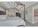 Spacious bedroom with tray ceiling, four-poster bed, and natural light at 7114 Mountain Brush Cir, Highlands Ranch, CO 80130