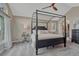 Beautiful bedroom with tray ceilings and a four-poster bed frame at 7114 Mountain Brush Cir, Highlands Ranch, CO 80130
