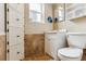 Bathroom with a white vanity, tiled floors, and a built-in storage cabinet that maximizes space and provides storage at 11855 Humboldt Dr, Northglenn, CO 80233
