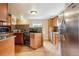 Modern kitchen featuring stainless steel appliances, granite countertops, and updated cabinets at 11855 Humboldt Dr, Northglenn, CO 80233