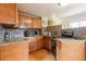 Updated kitchen featuring granite countertops, stainless steel microwave, and wood flooring at 11855 Humboldt Dr, Northglenn, CO 80233