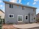 Home featuring a well-maintained backyard, patio, and classic gray siding at 306 Monares Ln, Erie, CO 80516