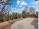 A well-maintained backyard featuring a stamped concrete patio and tastefully landscaped gravel area at 306 Monares Ln, Erie, CO 80516