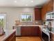 This well-maintained kitchen boasts stainless appliances and a window providing abundant light at 306 Monares Ln, Erie, CO 80516