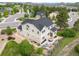 Aerial view showcases the home's patio, backyard, and stone landscaping nestled within a green and lush community at 1788 Holmby Ct, Castle Rock, CO 80104