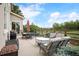 Outdoor patio area with dining set, grill, lounge seating, and lovely landscaping, perfect for outdoor living at 1788 Holmby Ct, Castle Rock, CO 80104