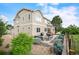 Backyard featuring a stone patio with a grill, a dining set, and beautiful landscaping, perfect for outdoor entertaining at 1788 Holmby Ct, Castle Rock, CO 80104