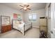 Bedroom with neutral walls, ceiling fan, and bright window offering scenic views at 1788 Holmby Ct, Castle Rock, CO 80104