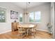 Bright dining area with hardwood floors, natural light, and casual seating at 1788 Holmby Ct, Castle Rock, CO 80104