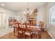 Elegant dining room featuring hardwood floors, a chandelier, and traditional furniture at 1788 Holmby Ct, Castle Rock, CO 80104