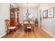 Charming dining room with hardwood floors, natural light, and classic wood furniture at 1788 Holmby Ct, Castle Rock, CO 80104