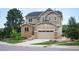 Charming home with a two-car garage, rock accents, and a well-maintained lawn at 1788 Holmby Ct, Castle Rock, CO 80104