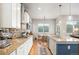 Bright kitchen featuring granite countertops, stainless steel appliances, and access to the dining area at 1788 Holmby Ct, Castle Rock, CO 80104