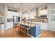 Spacious kitchen with a large island, stainless steel appliances, and ample counter space at 1788 Holmby Ct, Castle Rock, CO 80104