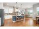 Bright kitchen featuring a center island with seating and modern appliances at 1788 Holmby Ct, Castle Rock, CO 80104