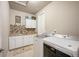 Bright laundry room featuring a utility sink with overhead storage and modern washer and dryer at 1788 Holmby Ct, Castle Rock, CO 80104