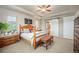 This comfortable bedroom features a decorative barn door leading to the bathroom at 1788 Holmby Ct, Castle Rock, CO 80104