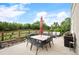 Back patio with dining table and chairs, grill, and outdoor seating at 1788 Holmby Ct, Castle Rock, CO 80104