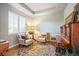 Cozy sitting room featuring patterned chairs, soft lighting, and elegant decor at 1788 Holmby Ct, Castle Rock, CO 80104