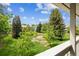 Relaxing balcony view overlooking the pond and trees of the community at 8335 Fairmount Dr # 9-201, Denver, CO 80247