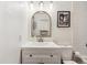 Modern bathroom with vanity and framed mirror at 8335 Fairmount Dr # 9-201, Denver, CO 80247