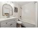 Modern bathroom features a white subway tile shower and vanity with a large mirror at 8335 Fairmount Dr # 9-201, Denver, CO 80247