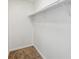 An empty closet with carpeting and a clothes rod at 8335 Fairmount Dr # 9-201, Denver, CO 80247