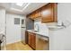 Updated kitchen with stainless steel appliances, tile backsplash, and wooden cabinets at 8335 Fairmount Dr # 9-201, Denver, CO 80247