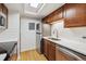 Updated kitchen features stainless steel appliances, white subway tile, and light hardwood floors at 8335 Fairmount Dr # 9-201, Denver, CO 80247