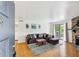 Cozy living room featuring a fireplace, hardwood floors, and natural light at 8335 Fairmount Dr # 9-201, Denver, CO 80247