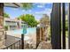 Community pool surrounded by well-maintained landscaping and fencing at 8335 Fairmount Dr # 9-201, Denver, CO 80247