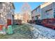 Common backyard area with grassy lawn and snow at 1885 S Quebec Way # L102, Denver, CO 80231