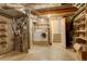 Unfinished basement with laundry hookups and storage shelves at 1885 S Quebec Way # L102, Denver, CO 80231
