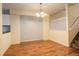 Small dining room with hardwood floors and chandelier at 1885 S Quebec Way # L102, Denver, CO 80231