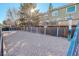 Community dog park with gravel surface and waste disposal at 1885 S Quebec Way # L102, Denver, CO 80231