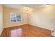 Entryway with wood floors, coat rack, and window at 1885 S Quebec Way # L102, Denver, CO 80231