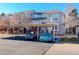 Exterior view of building with covered parking at 1885 S Quebec Way # L102, Denver, CO 80231