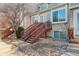 Townhouse exterior with stairs and stone accents at 1885 S Quebec Way # L102, Denver, CO 80231