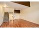 Spacious living area featuring hardwood floors and stairs at 1885 S Quebec Way # L102, Denver, CO 80231