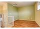 Small loft area with wood floors and light walls at 1885 S Quebec Way # L102, Denver, CO 80231