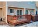 Private back patio with wood deck and stairs at 1885 S Quebec Way # L102, Denver, CO 80231