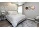 Serene bedroom featuring a full size bed, stylish decor, and a patterned rug at 6235 Stable View St, Castle Pines, CO 80108